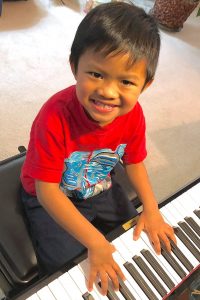 Child playing piano.